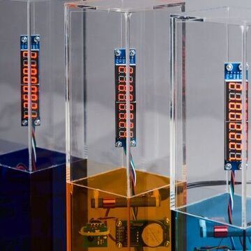 Drei Pokale Wettbewerb KI-Champions BW in Blau, Orange und Türkis