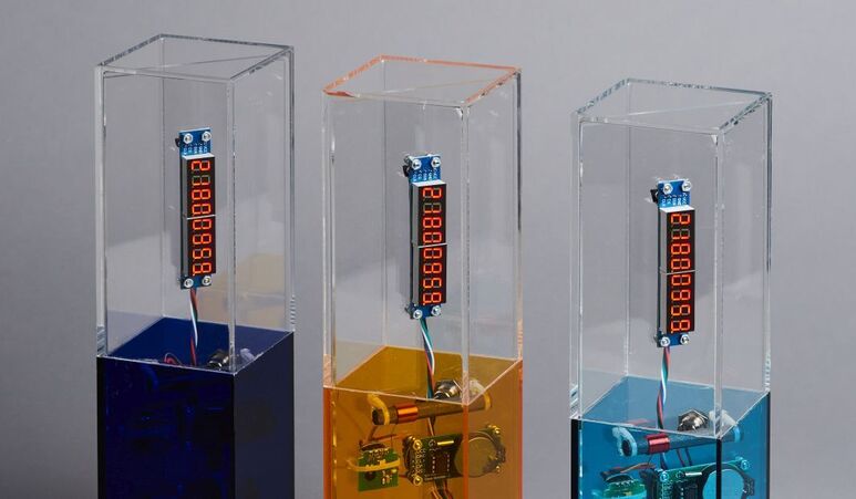 Drei Pokale Wettbewerb KI-Champions BW in Blau, in Orange und inTürkis