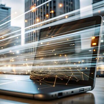 Laptop in mitten einer Großstadt mit generierten Funken die Geschwindigkeitslinien darstellen sollen