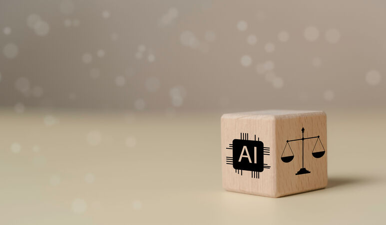 © The KonG - stock.adobe.com Wooden block featuring AI chip icon and legal scale