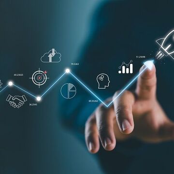 Mann zeigt auf einen virtuellen Bildschirm mit digitalen Symbolen und einer Rakete.